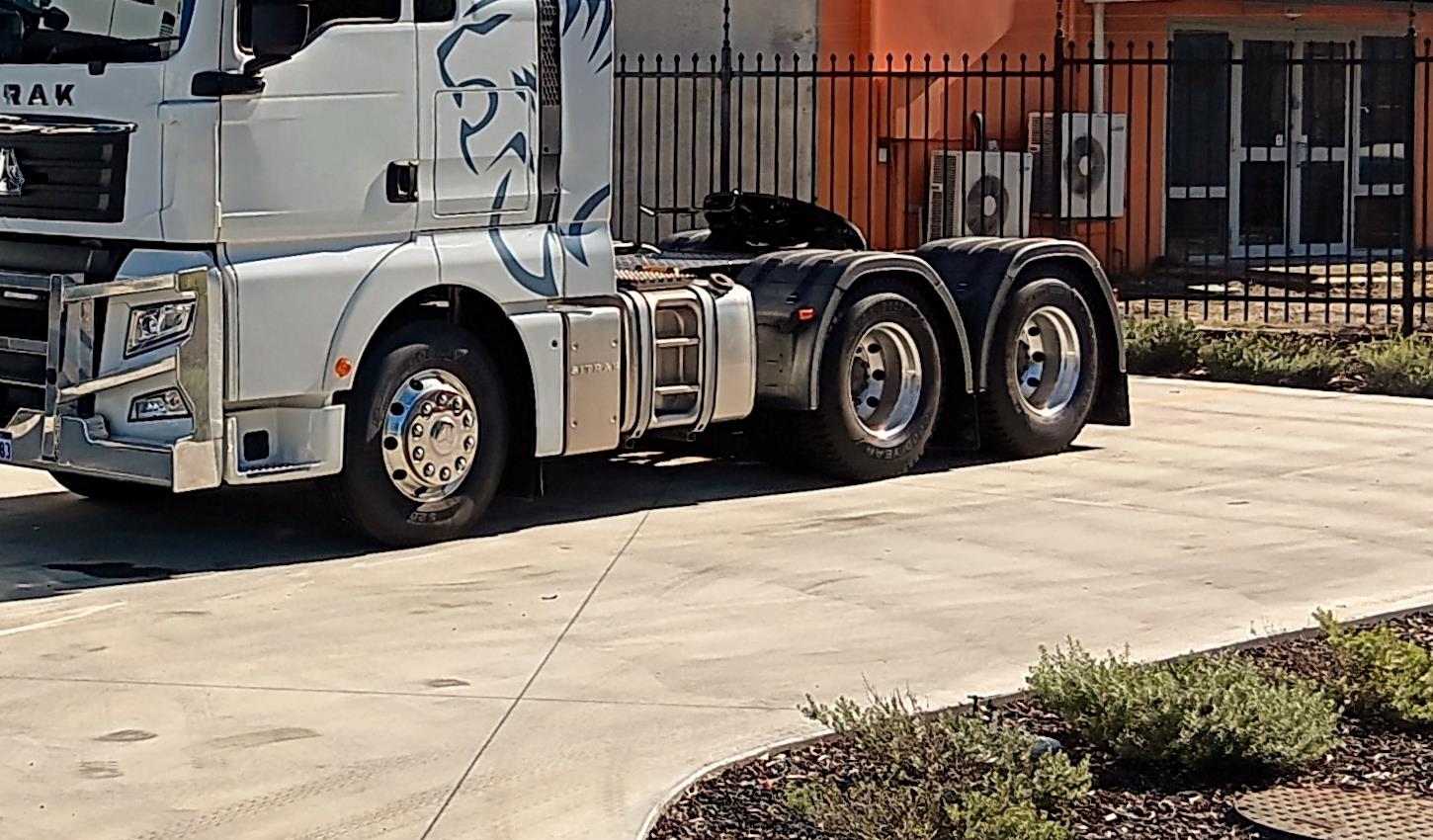 Heavy-duty truck on a highway, representing AE360 commercial lubricants